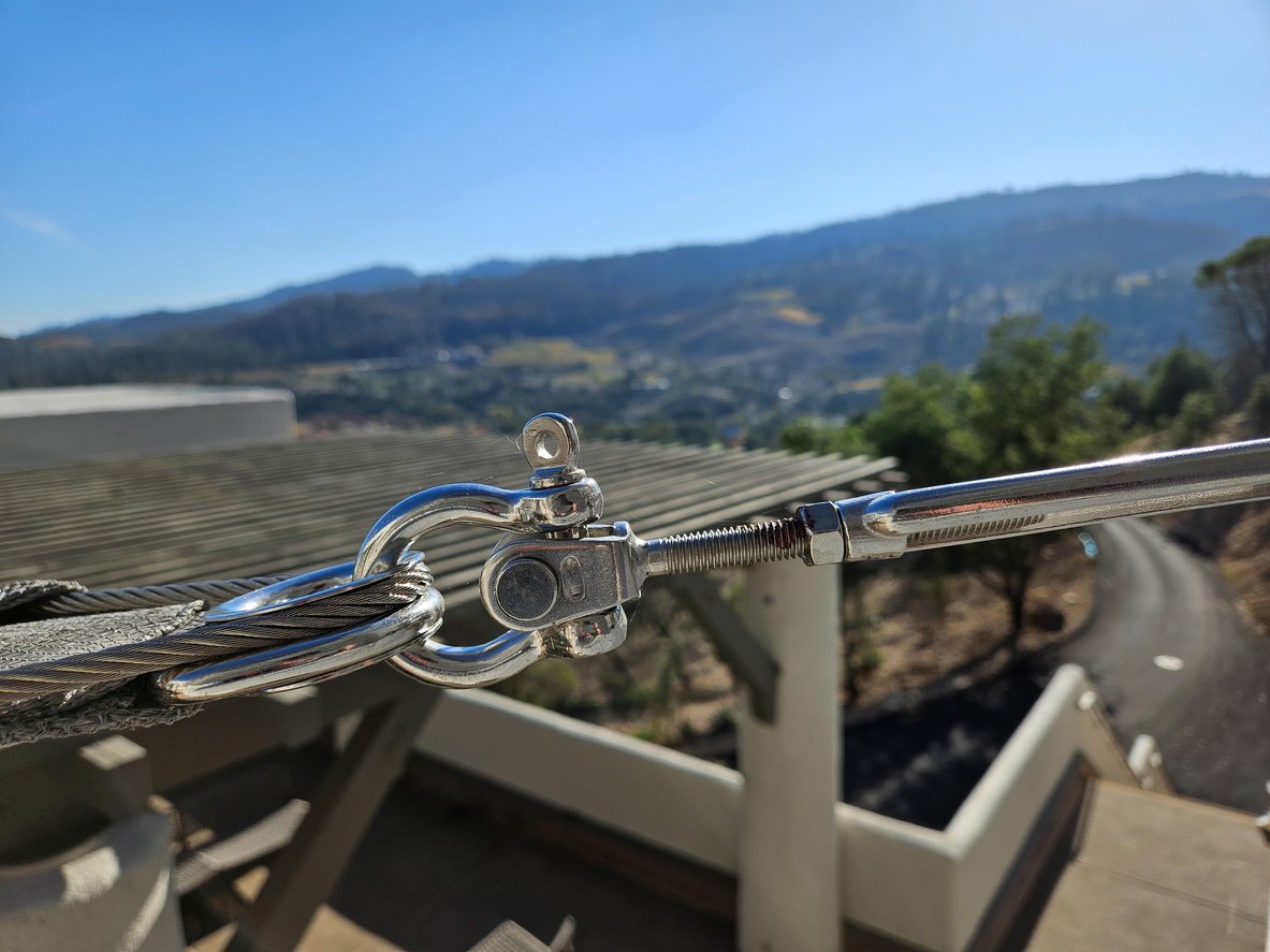 close up view of an eye bolt turnbuckle used for shade tie down to support structure